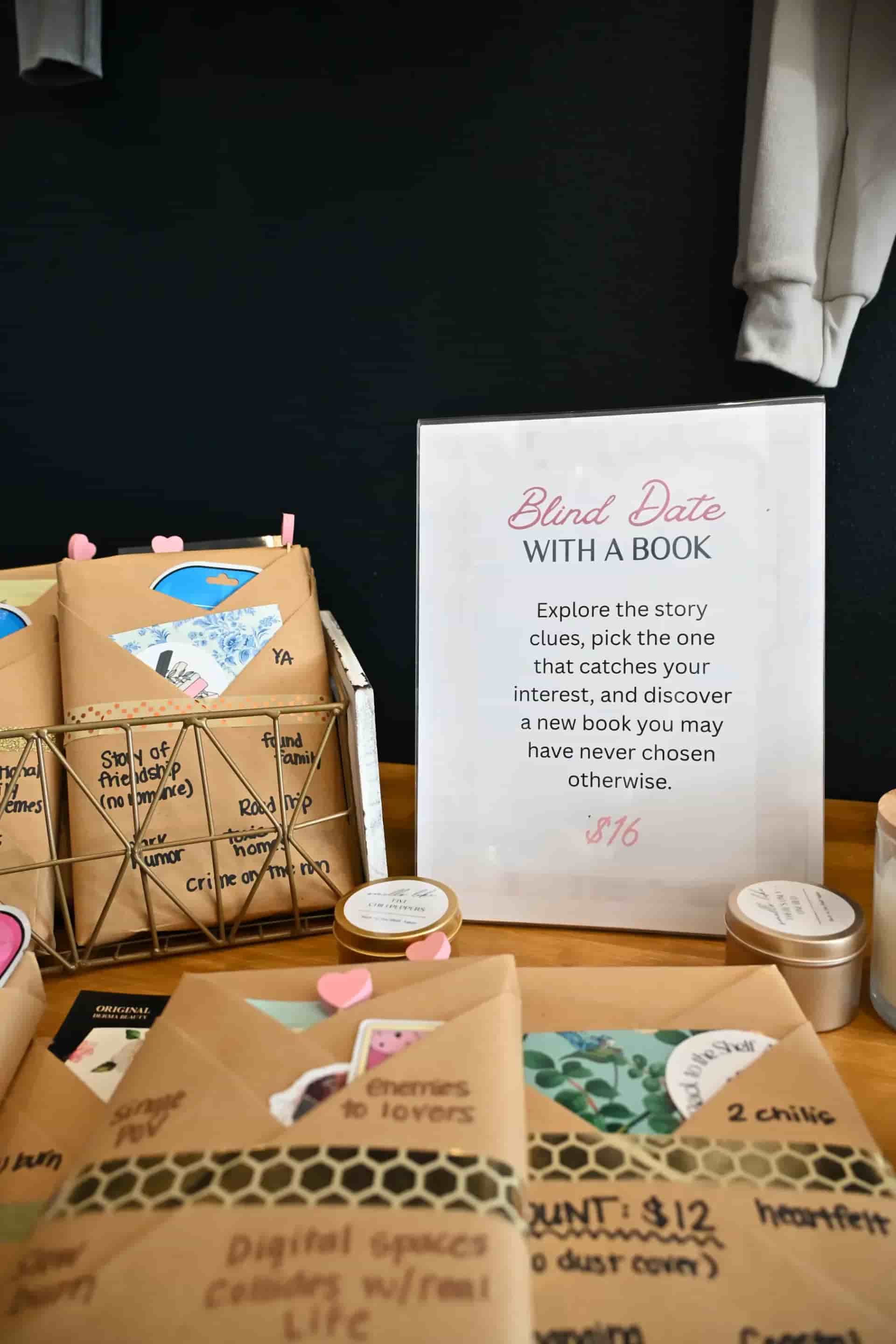 Books wrapped in brown paper next to a sign that says "Blind Date With a Book"