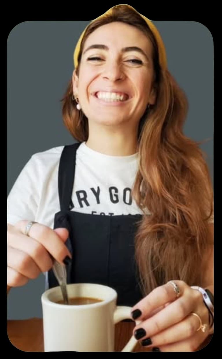 Molly, stirring a cup of coffee